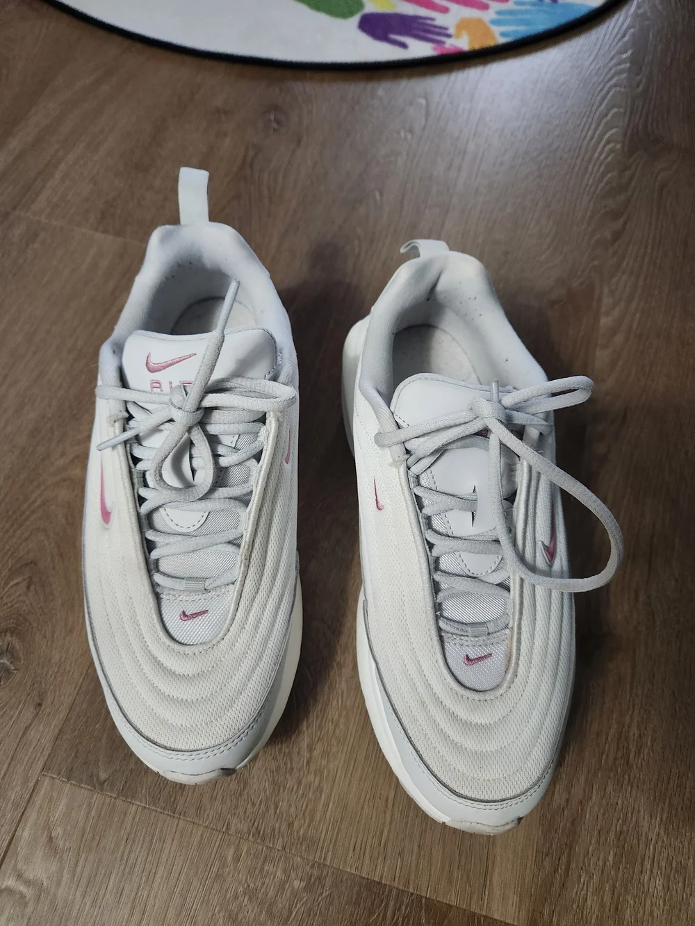 Nike White Sneakers with Pink Swoosh Accents